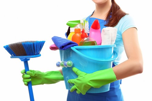 Cleaning and sanitising desks in a Barnet office